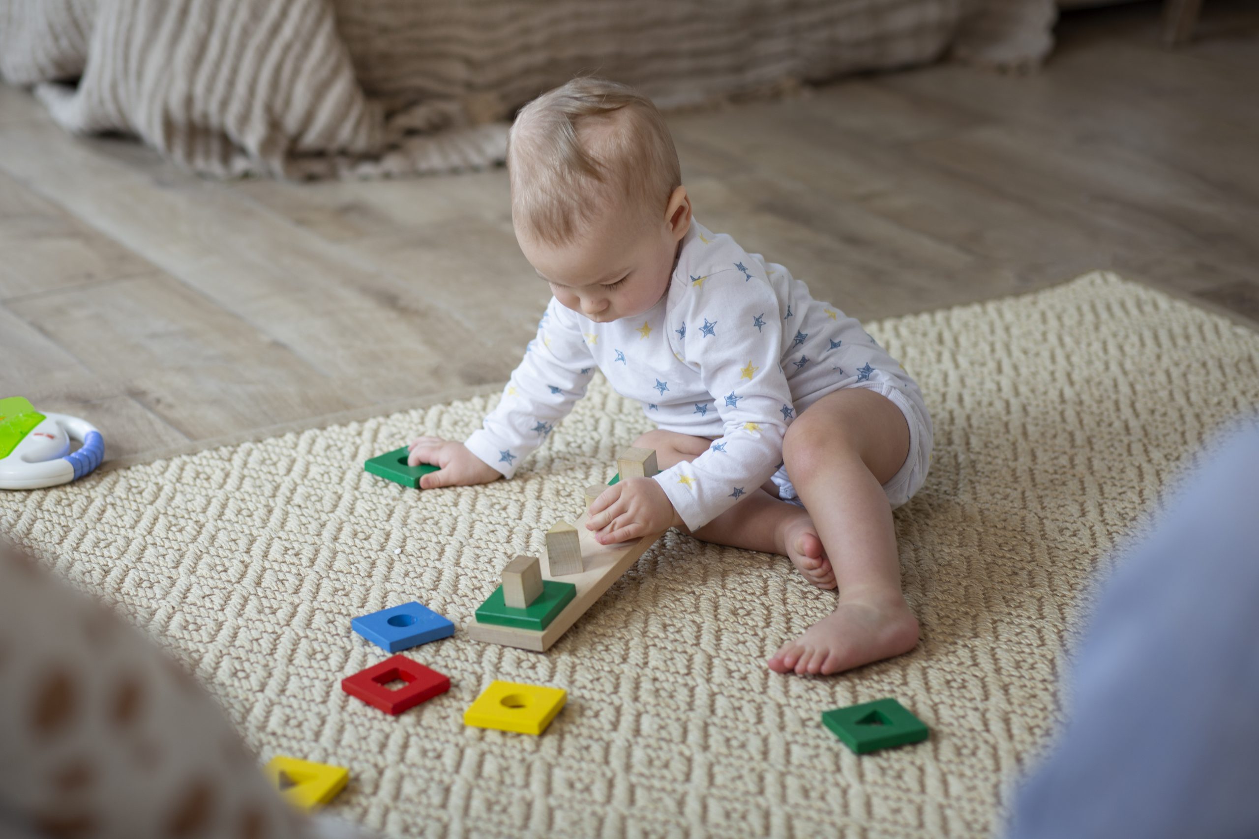 full shot cute baby playing floor